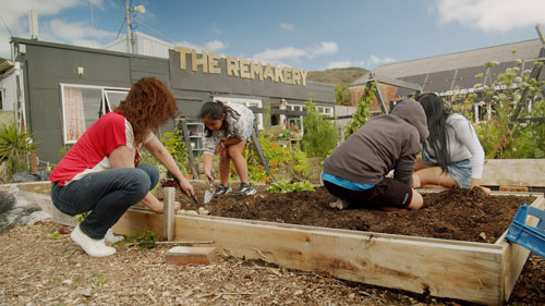 Planting potatoes in front of The Remakery
